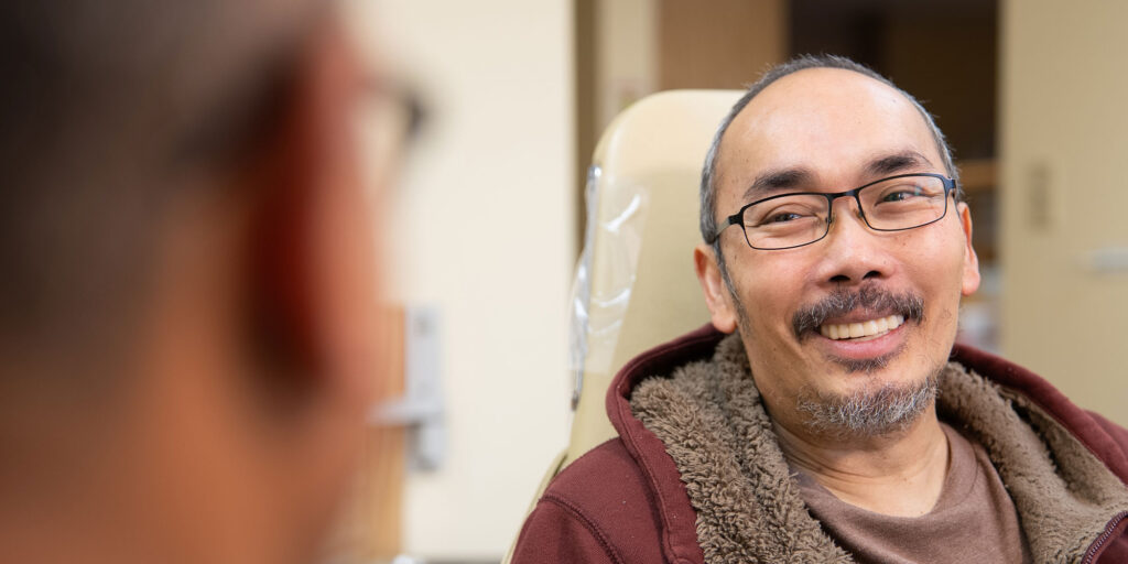 team member smiling at doctor