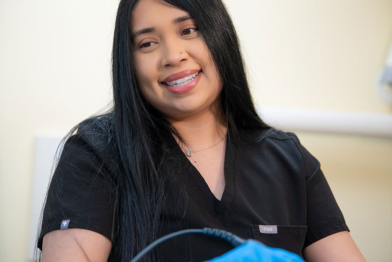 Team member taking a 3d scan of Patients teeth