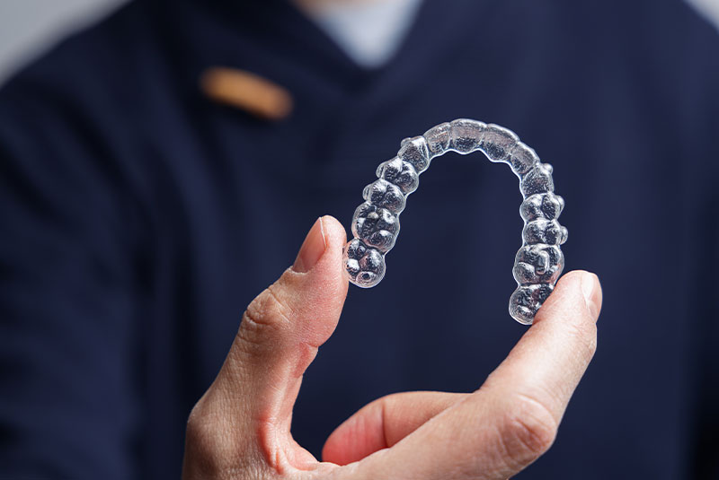 Doctor holding invisalign