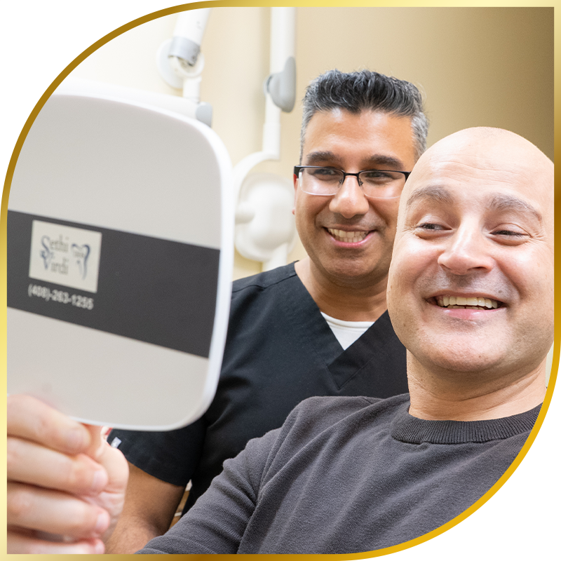 Patient and doctor looking into mirror