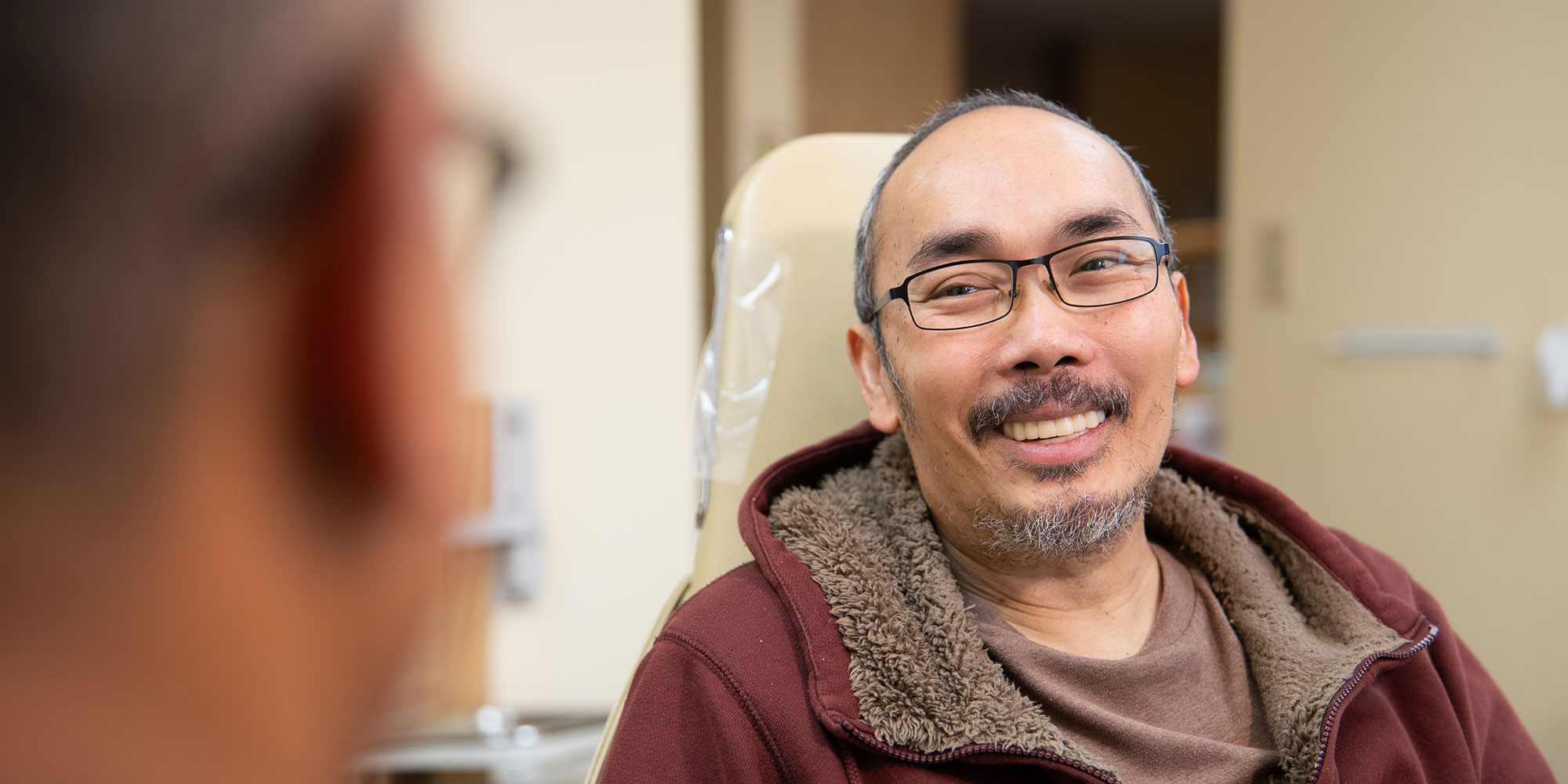Patient smiling at doctor