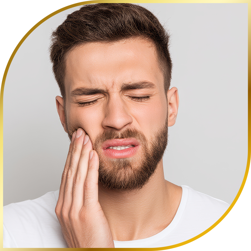 man holding mouth in pain
